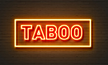 Taboo Neon Sign On Brick Wall Background.