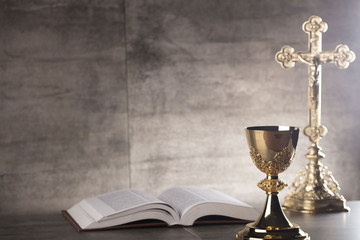 chalice, bible and altar cross.