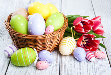  basket with easter eggs and tulips