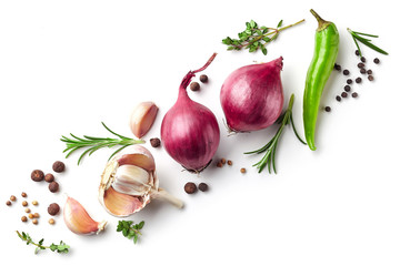 red onions and spices on white background