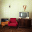 © Khorzhevska - Vintage room with wallpaper, tv, old fashioned armchair, retro player, loudspeakers, clocks and standart lamp, toned
