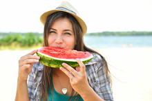 Happy Young Woman Eating Watermelon On The Beach. Youth Lifestyle. Happiness, Joy, Holiday, Beach, Summer Concept.