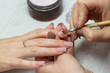 applying acrylic brush on nails