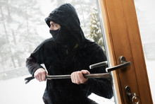 House Robbery - Robber Trying Open Door With Crowbar