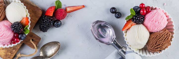 Selection of colorful ice cream scoops in white bowls