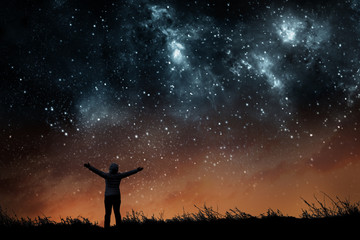 Wall Mural - girl watching the stars in night sky