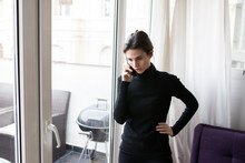 Woman Talking Phone Near Window