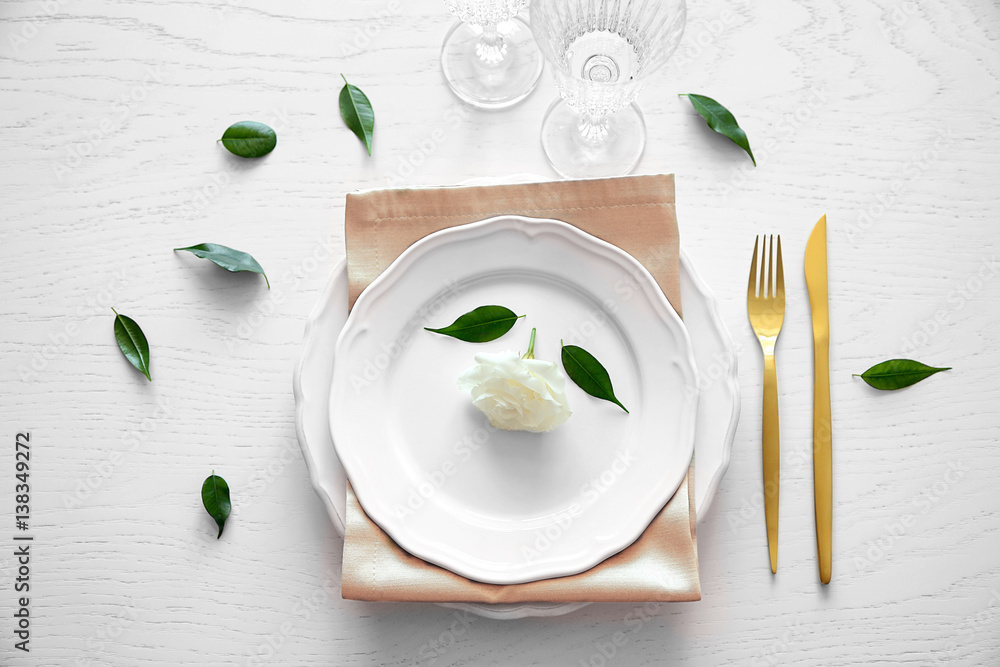 Table setting on wooden background