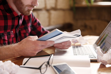 Hands of businessman working on laptop