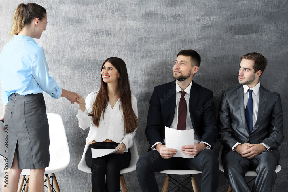 Group of young people waiting for interview indoors