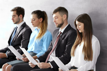 Wall Mural - Group of young people waiting for interview indoors