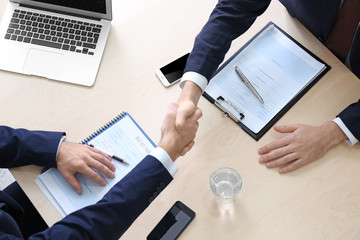 Canvas Print - Employer and applicant shaking hands after interview