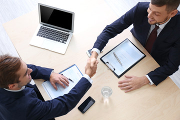 Wall Mural - Employer and applicant shaking hands after interview