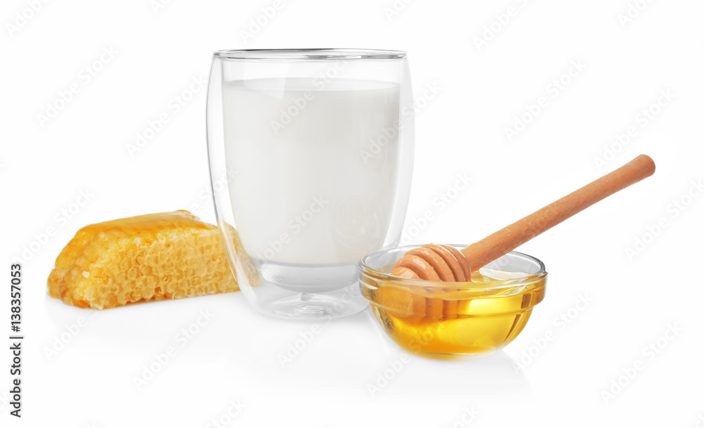 Composition with milk, honey and honeycomb on white background