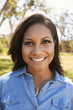 © Monkey Business - Head And Shoulders Portrait Of Young Woman In Park