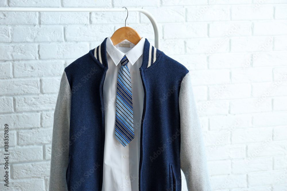 School uniform of teenage boy on hanger
