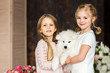 © Natalia Chircova - Little girls with a samoyed puppy