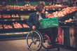 Disabled woman in a wheelchair in a grocery store