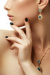 © looking2thesky - Beauty and fashion concept. Beautiful woman with jewelry, close-up. Beauty portrait of the fashion woman with golden manicure