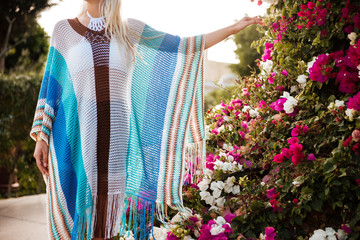 Poster - Cropped image of Woman in beachwear near the flower bush