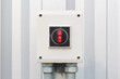 © DifferR - Industrial switch control button for electrical control outside factory building.