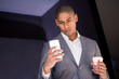 © ADDICTIVE STOCK - Man holding a paper cup and surfing the phone