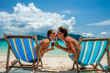 Sticker - Couple in loungers on a beach at Thailand