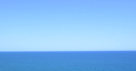 Wall Mural - Calm Ocean Water And Clear Blue Sky