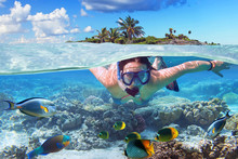 Young Woman At Snorkeling In The Tropical Water