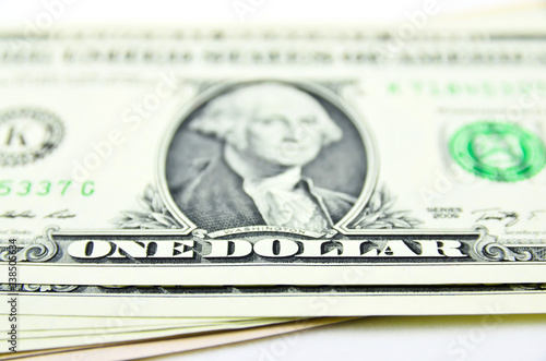 US dollars, one dollar sign in focus only foto Stock | Adobe Stock