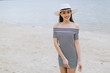 © anatoliycherkas - Stylish and fashionable girl in white hat posing on the summer beach.