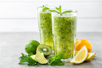 Sticker - fat burning green fruit cocktail with kiwi, lemon, mint and parsley for slimming and healthy diet