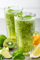 Sticker - fat burning green fruit cocktail with kiwi, lemon, mint and parsley for slimming and healthy diet