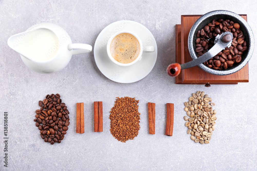 Fresh coffee with ingredients and accessories on grey background