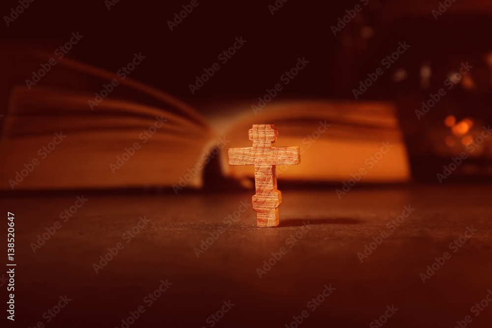 Bible with wooden cross, closeup