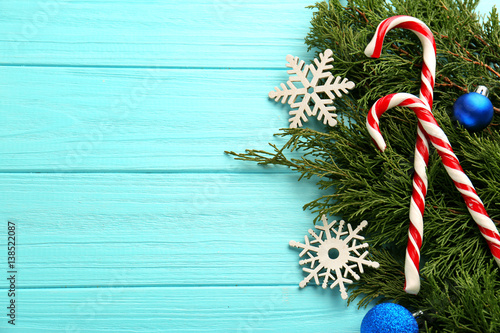 Christmas Decoration With Candy Canes On Blue Wooden
