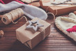 © Africa Studio - Gift box and Christmas decorations on wooden background