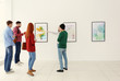 © Africa Studio - Young people in modern art gallery hall