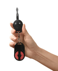 Wall Mural - Female hand holding car keys on white background