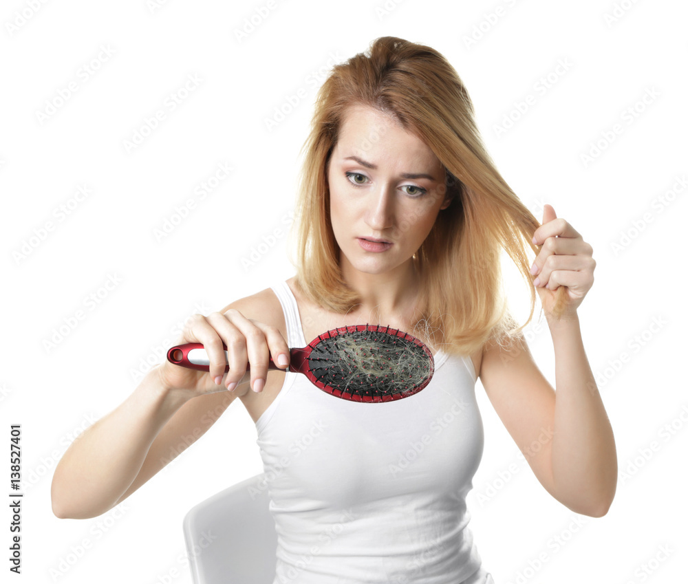 Young woman with hair loss problem on white background