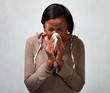 © grinny - sneezing black woman