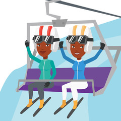 Sticker - Two happy skiers using cableway at ski resort.