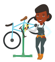 Sticker - African bicycle mechanic working in repair shop.