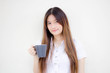 © tiniroma - Portrait of thai adult student university uniform beautiful drinking coffee