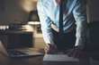 © Flamingo Images - business man doing late night paperwork