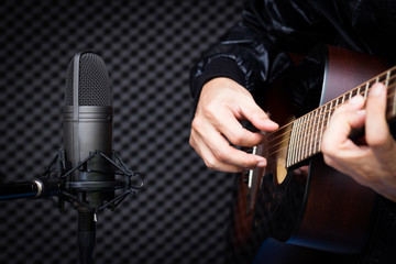 Wall Mural - condenser microphone recording acoustic guitar in studio