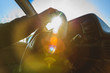 © johnalexandr - man sitting at the wheel of his car