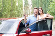 © Africa Studio - Beautiful young couple standing near red car with keys