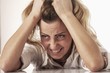 © zwiebackesser - Businesswoman in problems. Alone working in office with a lot of documents. Yelling and screaming for bad results. (psychological portrait, aggression, anger, frustration)