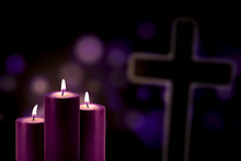 Purple Candles With A Cross Symbol